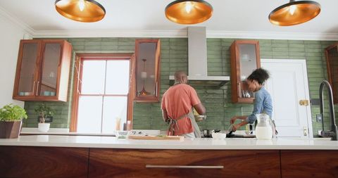Couple Cooking Together in Modern Kitchen Creating Delicious Meal