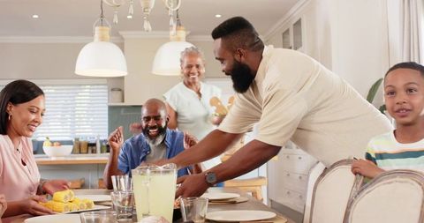Family enjoying meal time in bright kitchen setting
