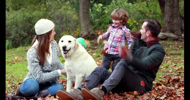 Family Playing with Dog Outdoors in Autumn Park - Download Free Stock Images Pikwizard.com