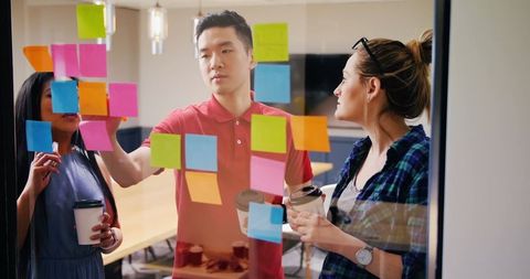 Creative Team Collaborating with Colorful Sticky Notes on Glass Wall - Download Free Stock Images Pikwizard.com