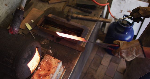 Blacksmith Forging Metal in Workshop with Glowing Red Hot Iron - Download Free Stock Images Pikwizard.com