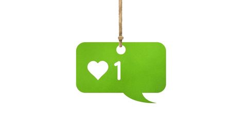 Green chat box with heart icon and one like