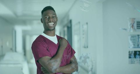 Confident Young Doctor in Modern Hospital Corridor