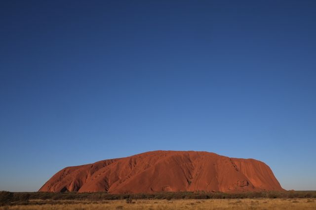 Majestic Uluru Rock Under Clear Blue Sky - Download Free Stock Images Pikwizard.com