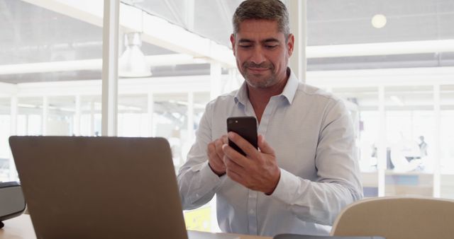 Businessman Using Smartphone During Office Work - Download Free Stock Images Pikwizard.com