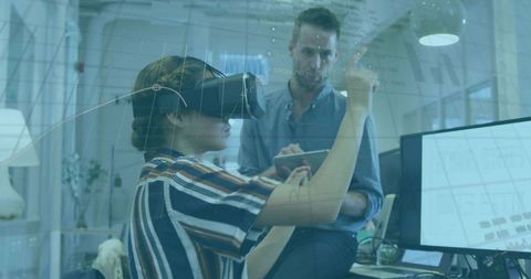 Woman wearing vr headset interacting with augmented hud for office team collaboration