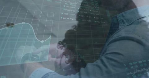 Businessperson analyzing digital market data in office