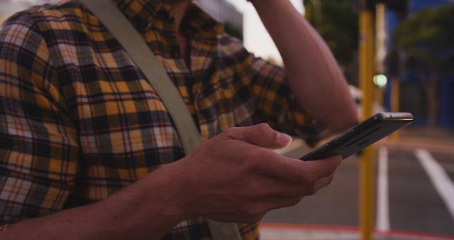 Person using smartphone outdoors during twilight - Download Free Stock Images Pikwizard.com