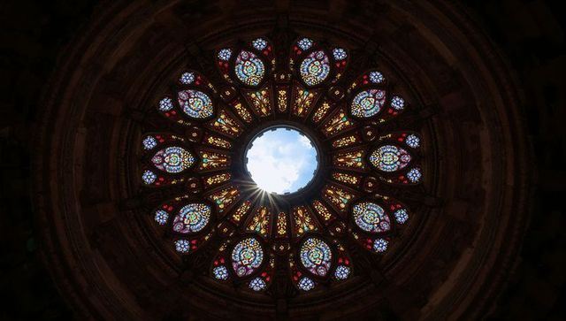 Stunning stained-glass cathedral dome with illuminated oculus