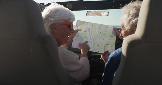 Senior Couple on Road Trip Navigating with Map Inside Car - Download Free Stock Images Pikwizard.com