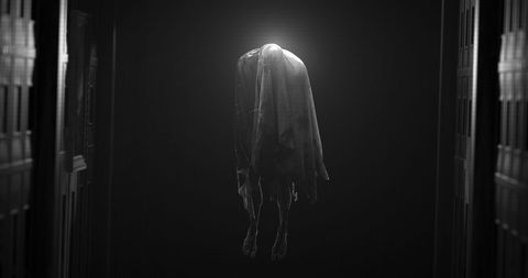 Mysterious hanging ghost in haunted hallway