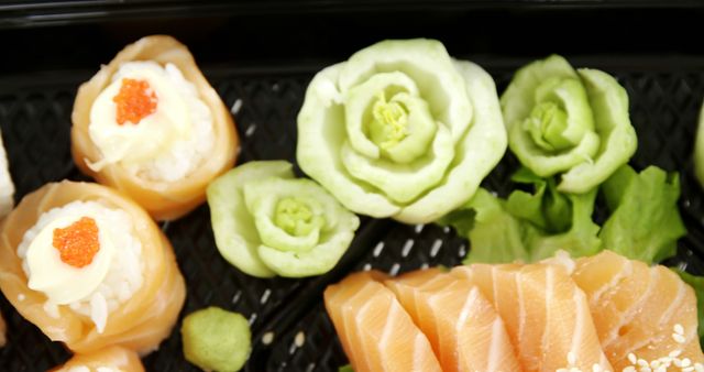 Close-up display of beautifully arranged sushi, including rolled sushi topped with fish roe, sashimi, and intricate vegetable garnish. Perfect for use in food blogs, Japanese restaurant menus, culinary magazines, and marketing materials showcasing fine dining and gourmet cuisine.