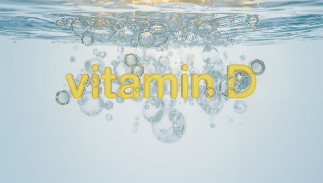 Floating yellow 3D Vitamin D text shimmering underwater with rising bubbles and glossy reflections