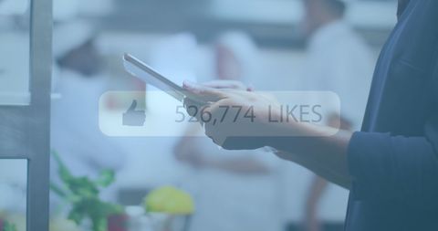 Businessman Using Tablet with Social Media Overlay