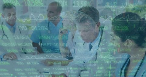 Doctors Discussing Medical Innovation While Overlaid with Stock Market Data