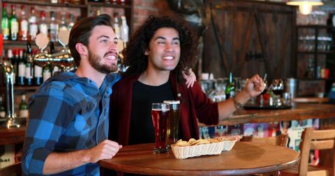 Friends Enjoying Drinks at Pub - Download Free Stock Images Pikwizard.com