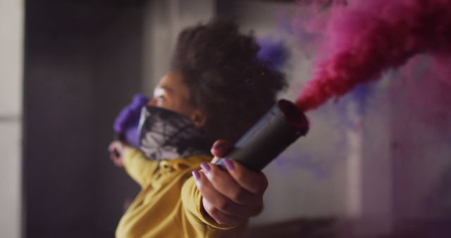 Rebellious Youth with Colored Smoke Bomb in Urban Setting - Download Free Stock Photos Pikwizard.com