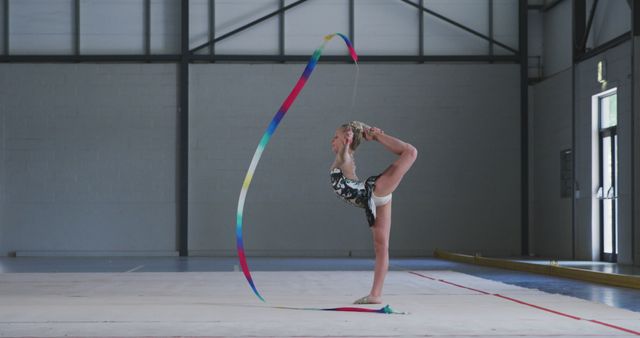 Young Gymnast Practicing Rhythmic Gymnastics with Ribbon in Gymnasium - Download Free Stock Images Pikwizard.com