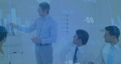 Presenter Discussing Corporate Strategy with Bar Graph in Business Meeting