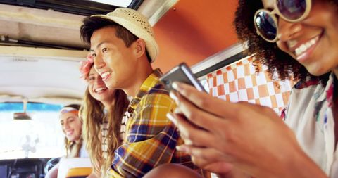 Diverse Friends Enjoying Youthful Road Trip Adventure Together