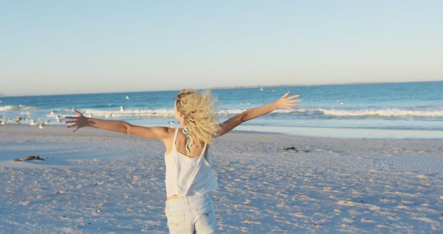 Carefree Woman Enjoying Beach Sunset with Open Arms - Download Free Stock Images Pikwizard.com