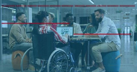 Diverse tech team collaborating in inclusive office with wheelchair and code overlay