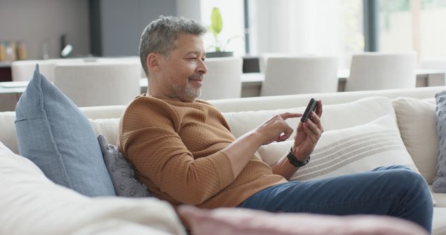 Senior Man Relaxing on Couch Using Smartphone - Download Free Stock Images Pikwizard.com