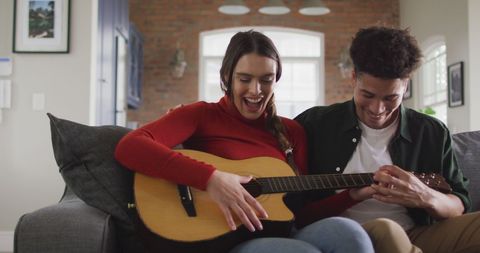 Happy Couple Enjoying Guitar Session Together