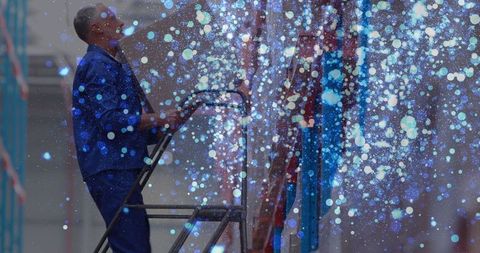 Warehouse Worker with Futuristic Digital Overlay