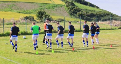 Soccer Team Training with Ladder Drills on Field
