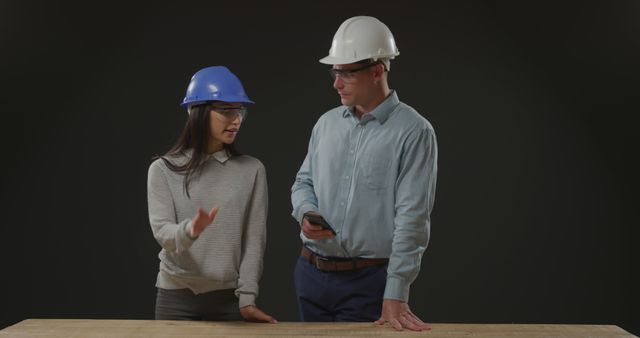 Engineers Collaborating on Project with Protective Gear - Download Free Stock Images Pikwizard.com