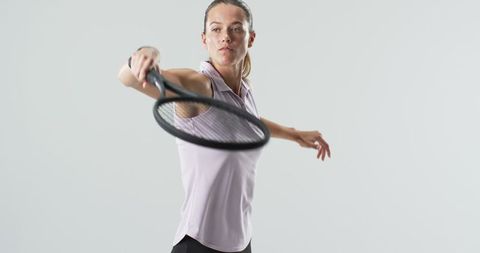 Focused Female Tennis Player Preparing for a Forehand Swing