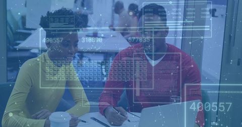 Colleagues Analyzing Innovative Data Trends in Modern Conference Room