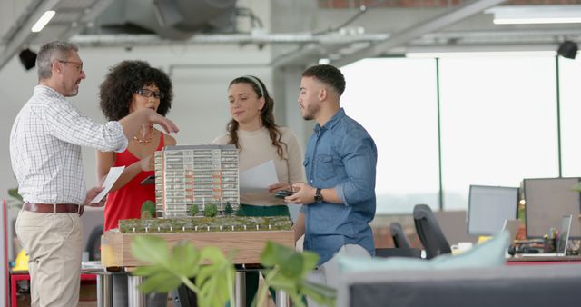 Architectural Team Reviewing Building Model in Modern Office - Download Free Stock Images Pikwizard.com