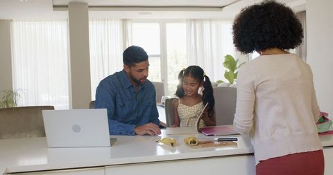 Diverse Family Enjoying Lunch Preparation Together in Modern Kitchen