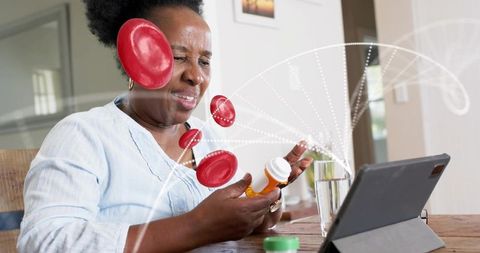 Senior black woman consulting tablet managing prescription meds with telehealth graphics
