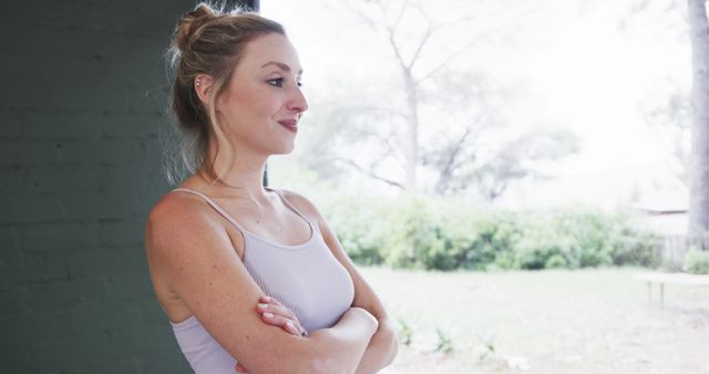 Pensive Woman Standing in Bright Open Space Looking Out Window - Download Free Stock Images Pikwizard.com