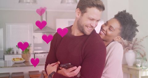 Diverse Couple Embracing in Cozy Kitchen Atmosphere