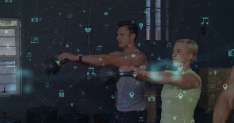 Couple performing kettlebell swings in dim gym with augmented reality fitness overlay