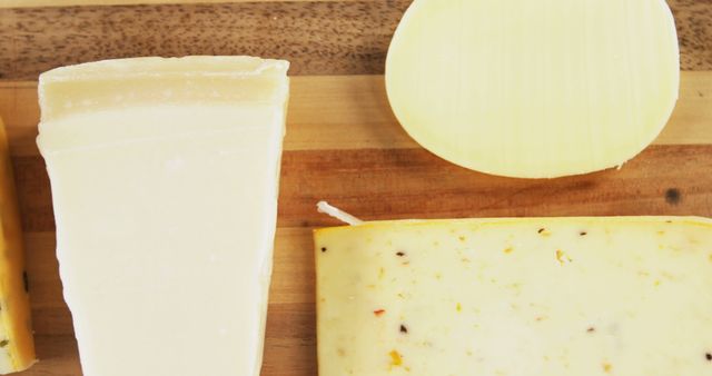 Assorted Cheese Selection Displayed on Wooden Board - Download Free Stock Images Pikwizard.com