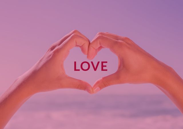 Hands creating a heart symbol against a soft pink gradient sky capture a serene vibe, symbolizing love and affection. Perfect for Valentine's Day promotions, expressing romantic emotions, personal greeting cards, or uplifting social media posts that communicate warmth and connection.