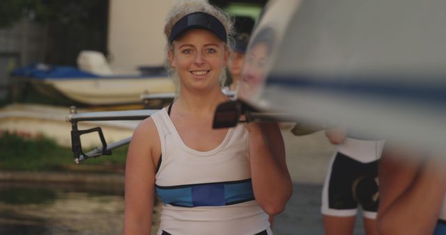 Female Rower Carrying Boat at Training Session Outdoors - Download Free Stock Images Pikwizard.com