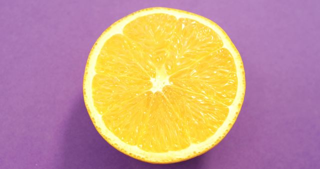 Half Orange on Bright Purple Background - Download Free Stock Images Pikwizard.com