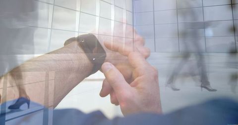 Professional Businessman Syncing Modern Smartwatch in Sleek Corporate Setting