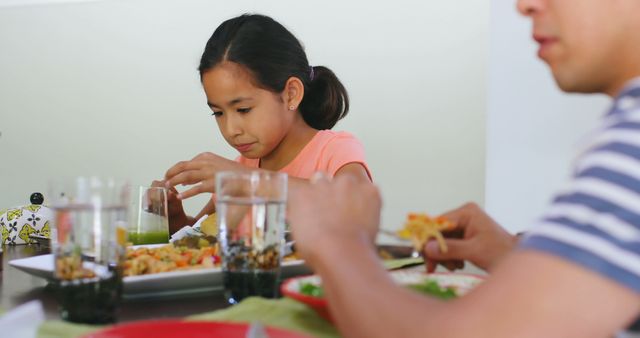 Family Having Casual Meal Together at Table - Download Free Stock Images Pikwizard.com