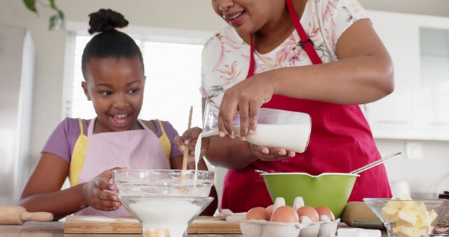 Mother and Little Daughter Baking Together in Modern Kitchen - Download Free Stock Images Pikwizard.com