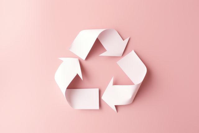 White arrows recycling sign on pink background, created using generative ai technology. Recycling, environment and climate change awareness concept digitally generated image.