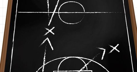Chalk-drawn sports game plan on blackboard