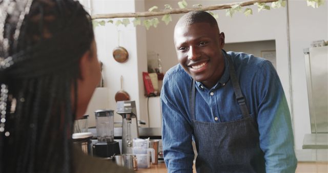 Smiling Barista Interacting with a Customer - Download Free Stock Images Pikwizard.com