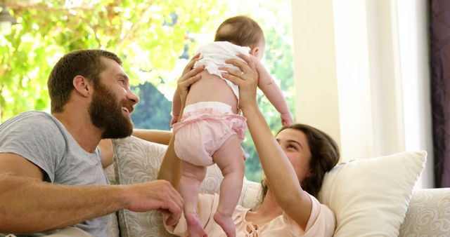 Happy Parents Enjoying Quality Time With Their Baby At Home - Download Free Stock Images Pikwizard.com